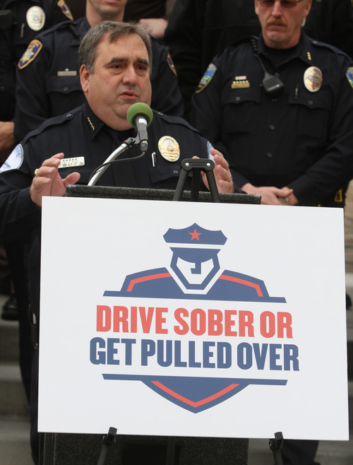 Rick Egan  |  The Salt Lake Tribune 
Cottonwood Heights Police Chief Robby Russo talks about the dangers of drinking and driving Thursday, Dec. 13, 2012. The snowman display at The Gateway in Salt Lake City is part of the "Drive sober or get pulled over" campaign.