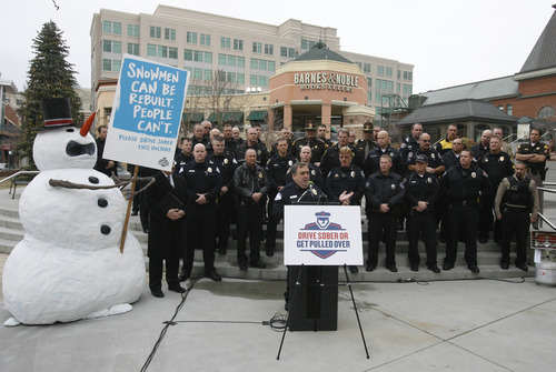 Rick Egan  |  The Salt Lake Tribune 
Cottonwood Heights Police Chief Robby Russo talks about the dangers of drinking and driving, Thursday, Dec. 13, 2012. The snowman display at The Gateway in Salt Lake City is part of the "Drive sober or get pulled over" campaign.