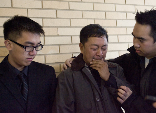 Kim Raff  |  The Salt Lake Tribune
Don Phan, left, brother of David Q. Phan, and family member Viet Dihn comfort Nhuan Phan, father of David, as he becomes emotional as a spokesperson for the family makes a statement about David Q. Phan, the 14-year-old who committed suicide outside of the Bennion Junior High School in Taylorsville, outside the Kearns Public Library in Kearns on December 2, 2012.  The family believes David was relentlessly bullied at school even as the school denies this accusation.