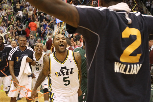 Rick Egan  | The Salt Lake Tribune 

Utah Jazz point guard Mo Williams (5) runs towards Utah Jazz power forward Marvin Williams (2) as he celebrates after hitting a 3-point shot at the buzzer to give the Jazz a 99-96 win over the San Antonio Spurs in NBA action, at the Energy Solutions Arena, Wednesday, December 12, 2012.