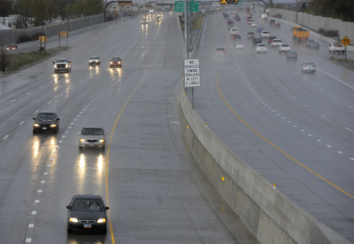 Sarah A. Miller  |  Tribune file photo
Early morning traffic heads northbound from Salt Lake City through hail and rain just past the 600 North exit off of I-15 on Tuesday, April 26, 2011. In 2012, Utah is on pace to have the fewest number of traffic fatalities since 1959.