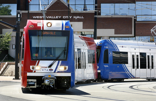 Scott Sommerdorf  |  Tribune file photo
A TRAX train passes by the West Valley City Hall as it leaves the West Valley Central Station on the newly opened green line in August 2011. Ridership numbers have thus far risen to only 80 percent of UTA's projections