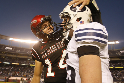 Photo by Chris Detrick  |  The Salt Lake Tribune 
San Diego State's Ryan Lindley #14 and Brigham Young's Max Hall #15 talk after the game at Qualcomm Stadium Saturday October 17, 2009. BYU won the game 38-28.