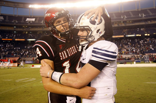 Photo by Chris Detrick  |  The Salt Lake Tribune 
San Diego State's Ryan Lindley #14 and Brigham Young's Max Hall #15 talk after the game at Qualcomm Stadium Saturday October 17, 2009. BYU won the game 38-28.