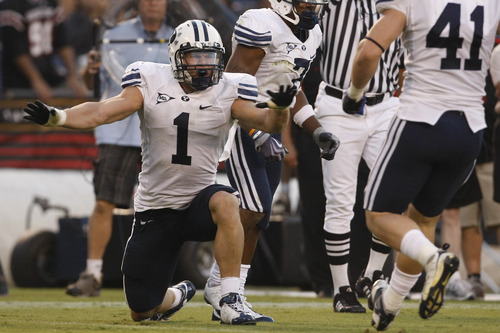 Photo by Chris Detrick  |  The Salt Lake Tribune 
Brigham Young's Jordan Pendleton #1 celebrates after making a stop during the second half of the game at Qualcomm Stadium Saturday October 17, 2009. BYU won the game 38-28.