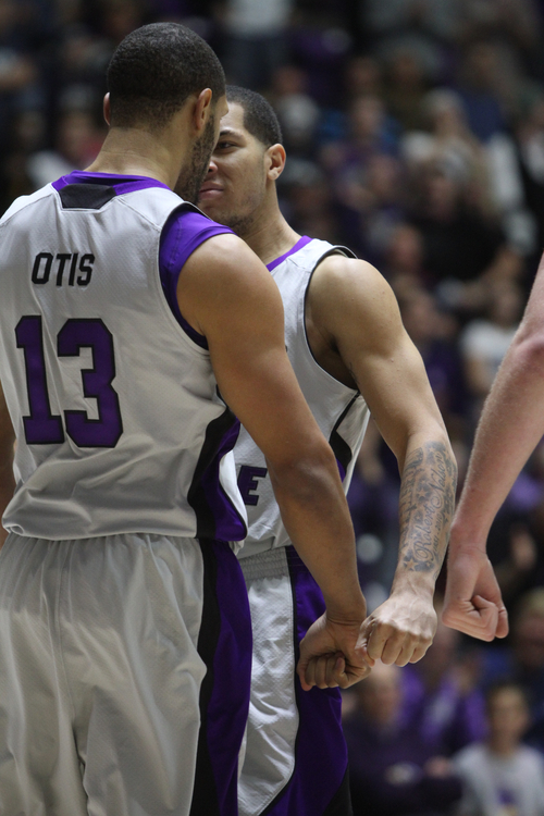 Rick Egan  | The Salt Lake Tribune 

Weber State Wildcats forward Frank Otis (13) and Weber State Wildcats guard forward Davion Berry (15) chest bump after Berry scored and was fouled on the play, in basketball action, BYU vs. Weber State, in Ogden, Saturday, December 15, 2012.