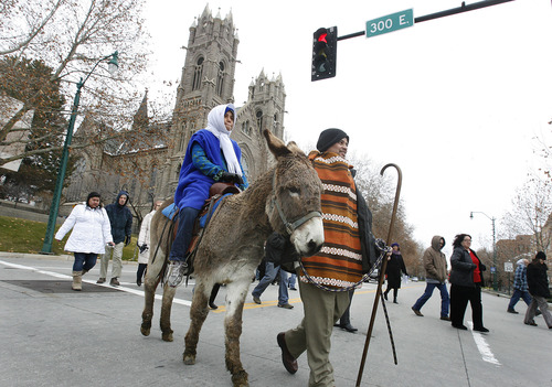 Scott Sommerdorf  |  The Salt Lake Tribune              
Asena Mafua, as "Mary" rides on a donkey led by her father, Maamalaa Mafua, as "Joseph" as the Las Posadas procession leaves the Cathedral of the Madeleine on its way through downtown Salt Lake City on Sunday. This procession honors the Latin American tradition of Las Posadas.