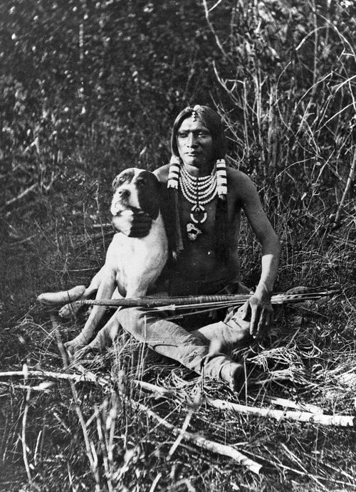 (Photo Courtesy Utah State Historical Society)

A young Ute warrior and his dog in the Uintah valley, eastern slope of the Wasatch Mountains. Photo by J.K. Hillers, Powell Expedition, 1873 and/or 1874.