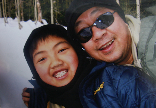 Scott Sommerdorf  |  The Salt Lake Tribune              
A family snapshot of David Phan with his father Nhuan.
The Phan family spoke out for first time, Saturday, December 15, 2012 about why David committed suicide on Nov. 29 at Bennion Junior High.
