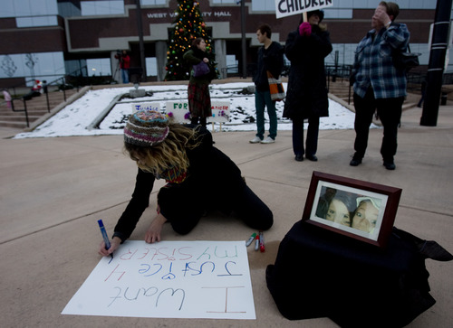Kim Raff  |  The Salt Lake Tribune
Kayleen Willard, sister of Danielle Willard, makes a sign outside the West Valley City Hall for a vigil Sunday for Danielle, who was shot by West Valley police on Nov. 2 as she sat in her car unarmed.