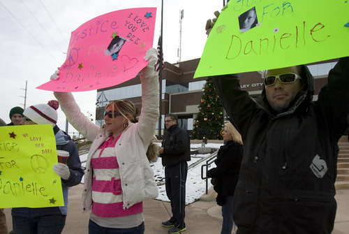 Kim Raff  |  The Salt Lake Tribune
(from left) Ashley Putnam, Krystle Harrison and Justin Elswood join three dozen people who gather outside the West Valley City Hall for a vigil for Danielle Willard, who was shot by West Valley Police on Nov. 2 as she sat in her car unarmed, in West Valley City on December 16, 2012. The three were good friends with Willard.
