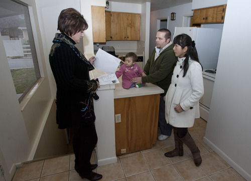 Steve Griffin | The Salt Lake Tribune


Realtor Donna Pozzuoli, left, shows Matt and Megumi Garriott and their daughter, Mia Grace,  a 2200 square foot home in Salt Lake City, Utah Tuesday December 18, 2012. Pozzuoli says she may have missed six sales and $12,000 in commissions because some of her clients are nervous that the fiscal cliff deadline will pass without an agreement on how to reduce the budget deficit and nation's debt. Some clients feel their taxes will rise; others worry that their employers might need to lay them off.