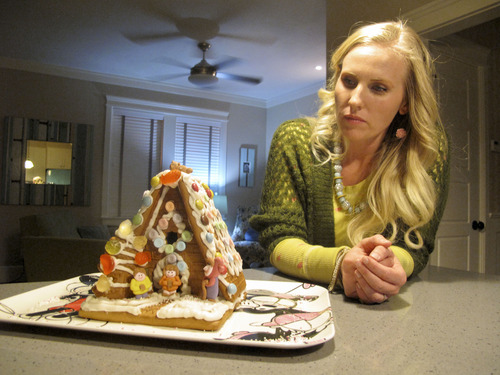 Cimaron Neugebauer | The Salt Lake Tribune
Lynette Hamblin shows off a gingerbread house designed to look like the 'Up' house in her home on Tuesday night. This is just one of her Christmas decorations inside the iconic Disney house in Herriman. The house is a full-scale rendition of the house in the Disney/Pixar movie "Up."
