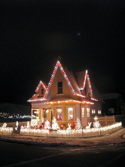 Cimaron Neugebauer | The Salt Lake Tribune
Bangerter Homes' full-scale rendition of the house in the movie "Up," located at 13215 S. 5390 West in Herriman is lit for Christmas time. On Dec. 22 Santa Claus will visit the porch of the house for free photos for anyone. Donations are encouraged for a Sub-for-Santa family.