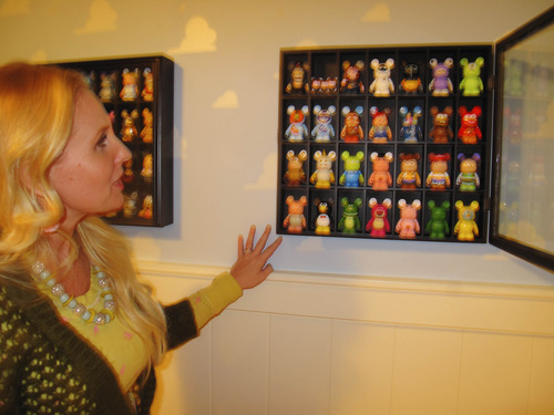Cimaron Neugebauer | The Salt Lake Tribune
Lynette Hamblin displays a glass case in one of her bedrooms filled full with Vinylmations -- a combination of the words vinyl and animation, They are Disney collectables all shaped like Mickey Mouse but represent different characters from movies. The house is a full-scale rendition of the house in the Disney/Pixar movie "Up."