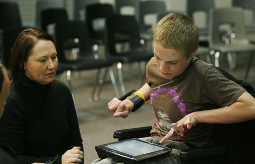 Francisco Kjolseth  |  The Salt Lake Tribune
Shelsee Kirk watches as her son Tanner Kirk, 16, a teen who attempted suicide at the age of 13, speaks through a voice projecting computer prior to meeting with Jordan High students for an assembly entitled "Suicide Shouldn't be a Secret!" Tanner survived the attempt and now sits in a wheelchair and can barely talk.