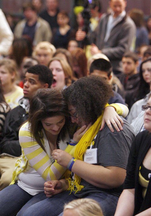 Francisco Kjolseth  |  The Salt Lake Tribune
Stormi Schweppe, 16, left, and Ariel Arevalo, 17, embrace after taking to heart the words of Tanner Kirk, a 16-year-old who attempted suicide three years ago and now speaks with the help of a voice projecting computer. Jordan High School students packed in for an optional assembly entitled "Suicide Shouldn't be a Secret!" on Tuesday, December 18, 2012.