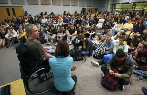 Francisco Kjolseth  |  The Salt Lake Tribune
Jordan High School students pack in for an assembly entitled "Suicide Shouldn't be a Secret!" as Tanner Kirk, 16, left, a teen who attempted suicide at the age of 13, speaks to them with the help of a voice projecting computer. He survived the attempt and now sits in a wheelchair and can barely talk. Many of the students in attendance have been personally affected by suicide, the second leading cause of death among Utah teens. In 2011, 11,503 Utah teens made a suicide attempt according to the American Foundation for Suicide Prevention.