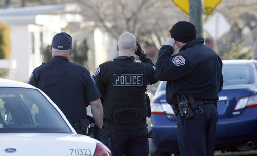 Francisco Kjolseth  |  The Salt Lake Tribune
West Valley City police evacuate a 2-3 block area surrounding 3150 S. Cantwell St. (2910 West), as they look through binoculars at negotiations with a suspect who reportedly fired a gun during a standoff at a home.