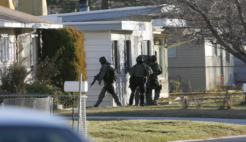Francisco Kjolseth  |  The Salt Lake Tribune
West Valley City police evacuate a 2-3 block area surrounding 3150 S. Cantwell St. (2910 West), as they deal with a suspect who reportedly fired a gun during a standoff at a home.