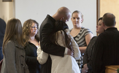 Steve Griffin | The Salt Lake Tribune


Eric Charlton, who pled guilty to accidentally fatally shooting his brother in the head during a camping trip, his hugged by family and frounds following his sentencing hearing in 4th District Court in Nephi, Utah Thursday December 20, 2012.  I