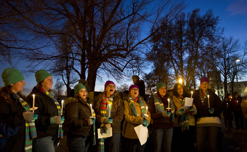 Lennie Mahler  |  The Salt Lake Tribune
The House of Hope Choir sings during a candlelight vigil remembering the homeless people who have died and recognizing the struggles members of the homeless population face heading into Winter. The event, organized by the Fourth Street Clinic and the Salt Lake County Homeless Coordinating Council, was held at Pioneer Park and is part of a nationwide event on the eve of the Winter Solstice. Thursday, Dec. 20, 2012.