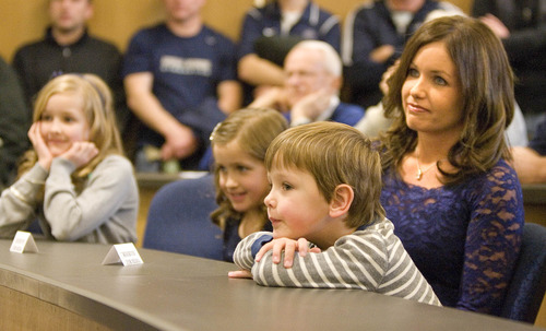 Paul Fraughton  |   Salt Lake Tribune
The family of Matt Wells, daughters Jadyn (10), Ella (7), son, Wyatt (4) and Jen, his wife watch as he is introduced as the 27th head coach of Utah State University's  football program at a press conference in Logan.
 Thursday, December 20, 2012
