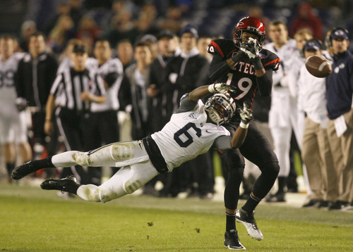 Rick Egan  | The Salt Lake Tribune 

Brigham Young Cougars defensive back Jordan Johnson (6) deflects a pass intended for San Diego State Aztecs wide receiver Brice Butler (19) as BYU defeated San Diego State 23-6 in the Poinsettia Bowl, Thursday, December 20, 2012.