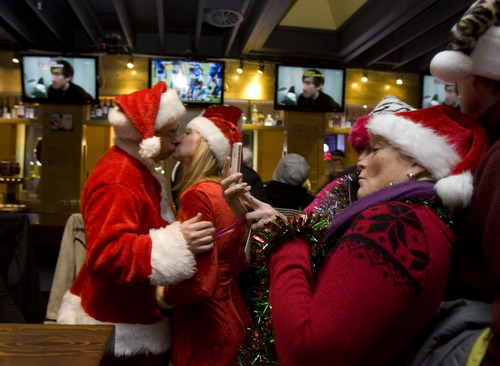 Kim Raff  |  The Salt Lake Tribune
People dressed as Santa Claus or in festive Christmas costumes fill Gracie's Bar for the first stop of SantaCon 2012 pub crawl in Salt Lake City on December 22, 2012.