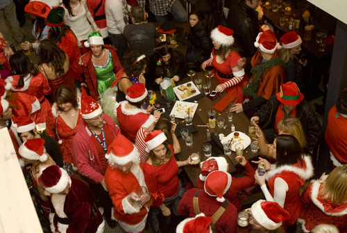 Kim Raff  |  The Salt Lake Tribune
People dressed as Santa Claus or in festive Christmas costumes fill Gracie's Bar for the first stop of SantaCon 2012 pub crawl in Salt Lake City on December 22, 2012.