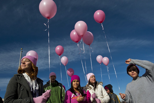 Chris Detrick  |  The Salt Lake Tribune
Sadee Fain, 16, Carmen Morales, 17, Erin O'Connell, 17, and Shawnee Sanders, 16, hold pink balloons on the sidewalk along Monroe Blvd, as they wait for Emilie Parker's hearse to pass on the way to Myers Evergreen Memorial Park Saturday December 22, 2012.  Emilie Parker, 6, was one of 20 children massacred by a gunman Dec. 14 at Sandy Hook Elementary School in Newtown, Conn.