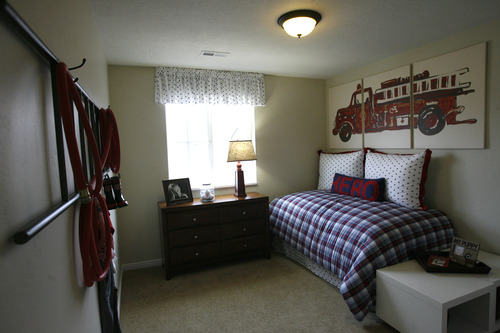 Rick Egan  | The Salt Lake Tribune 

Bedroom in The Hawthorne, one of the Woodside Model Homes in the Foxboro subdivision, on Danby Drive, in the Foxboro North Community of North Salt Lake, Wednesday, December 12, 2012. Woodside Homes is a North Salt Lake-based builder and one of the biggest home builders in the U.S.