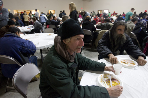 Kim Raff  |  The Salt Lake Tribune
Lynn Gates eats his meal during the Salt Lake City Mission's Christmas day meal at the Christian Life Center in Salt Lake City on December 25, 2012.