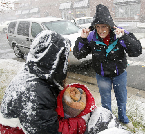 Al Hartmann  |  The Salt Lake Tribune
Homeless advocate Pamela Atkinson checks in with a homeless woman in Sugarhouse during a snowstorm Monday December 24 to see if she was allright.  She needed a warm blanket and hot meal and got an invitation to a steak dinner on Christmas day.   Atkinson and Ed Snoddy, medical outreach coordinator for the Volunteers of America visited homeless people around Salt Lake City offering hot meals, boots, and warm clothing to help get them through the cold weather.