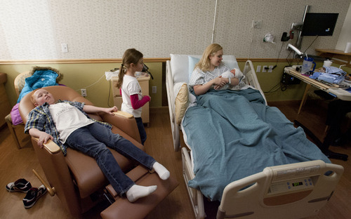 Steve Griffin | The Salt Lake Tribune

Angie Call holds her newborn son, Jackson, as she is visited by the rest of her family including son Josh, 11, and daughter Natalie, 8, at Altaview Hospital in Sandy, Utah Friday December 21, 2012.