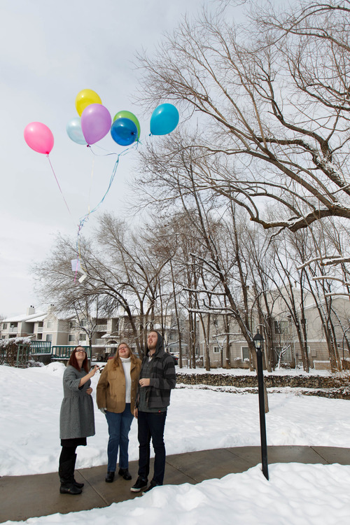 Trent Nelson  |  The Salt Lake Tribune
Stephanie Cook, left, releases balloons to mark the day her mother, Bobbi Campbell, disappeared 18 years ago. Thursday December 27, 2012 in Cottonwood Heights. With Cook is Rebecca Storrs and Cook's husband Trevin Cook.