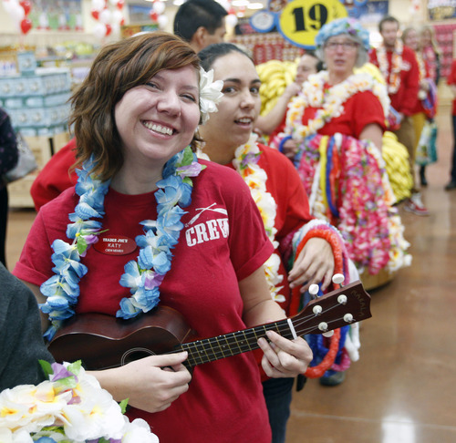 Al Hartmann  |  The Salt Lake Tribune
Customers are greeted by Trader Joe's employees with a flower leis and a party atmosphere as they enter the new store for at 634 East 400 South in Salt Lake City Friday November 30 at 8 a.m.