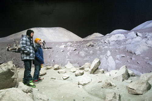 Chris Detrick  |  The Salt Lake Tribune
Tyler and Cole Yoklavich, of Price, explore a moon exhibit at the Clark Planetarium.