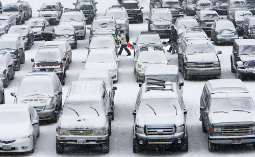 Steve Griffin | The Salt Lake Tribune


Snowboarders make their way across a parking lot full of snow covered cars at Brighton ski resort in Brighton, Utah Wednesday December 26, 2012.
