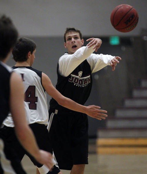 Al Hartmann  |  The Salt Lake Tribune
 Jordan point guard Chandler Smith, scrimmages with Beet Digger teammates Wednesday December 26.   He was one assist off the state record in a game earlier this month.