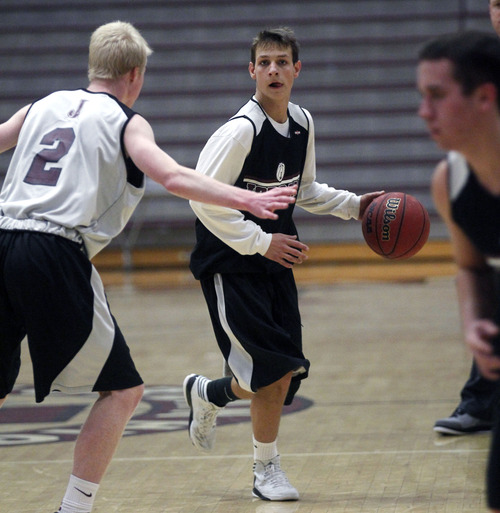 Al Hartmann  |  The Salt Lake Tribune
 Jordan point guard Chandler Smith, scrimmages with Beet Digger teammates Wednesday December 26.   He was one assist off the state record in a game earlier this month.