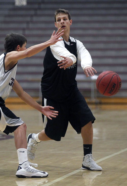 Al Hartmann  |  The Salt Lake Tribune
 Jordan point guard Chandler Smith, scrimmages with Beet Digger teammates Wednesday December 26.   He was one assist off the state record in a game earlier this month.