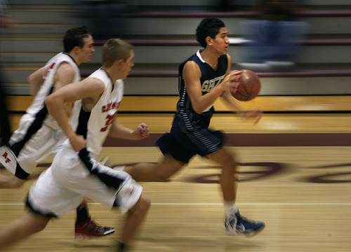 Scott Sommerdorf   |  The Salt Lake Tribune
Copper Hills' Darius Maluia rushes up court  after a steal during first  half play. American Fork beat Copper Hills 48-39 in the Jordan Holiday Tournament, Thursday, December 27, 2012.