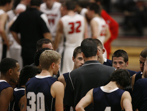 Scott Sommerdorf   |  The Salt Lake Tribune
Grizzly players, including Austin McCombs, center, have their eyes on Copper Hills head coach Andrew Blanchard during a time out in the second half. American Fork beat Copper Hills 48-39 in the Jordan Holiday Tournament, Thursday, December 27, 2012.