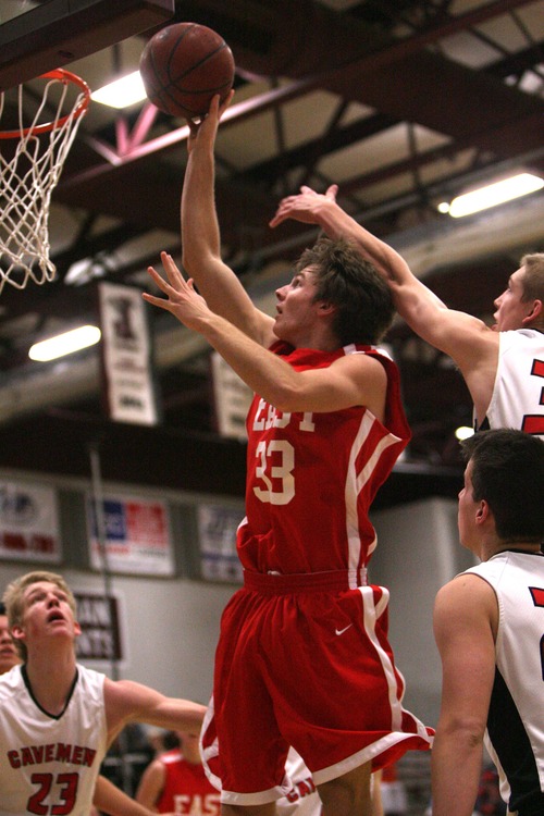 Leah Hogsten  |  The Salt Lake Tribune
East's Mitch Grant scored 15 points during the game. East High School mens basketball team defeated American Fork 85-74 during their quarterfinal game at the Jordan Holiday boys' basketball tournament at Jordan High School Friday December 28, 2012 in Sandy.