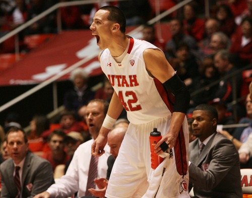 Kim Raff  |  The Salt Lake Tribune
University of Utah center Jason Washburn (42) cheers his teammates on from the sidelines as they lead the game against College of Idaho at the Huntsman Center in Salt Lake City on December 28, 2012.