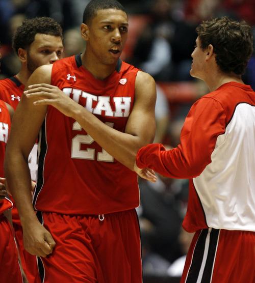 Rick Egan  | The Salt Lake Tribune 

Utah Utes forward Jordan Loveridge (21) celebrates after hitting a big three-pointer, in the second half, Saturday, November 24, 2012. The Utes defeated the Wright State Raiders, 66-54, in the Thanksgiving Tournament at the Huntsman Center,