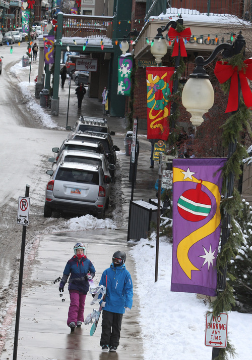Rick Egan  | The Salt Lake Tribune 

Skiers walk down lower Main Street in Park CIty, Friday, December 28, 2012.