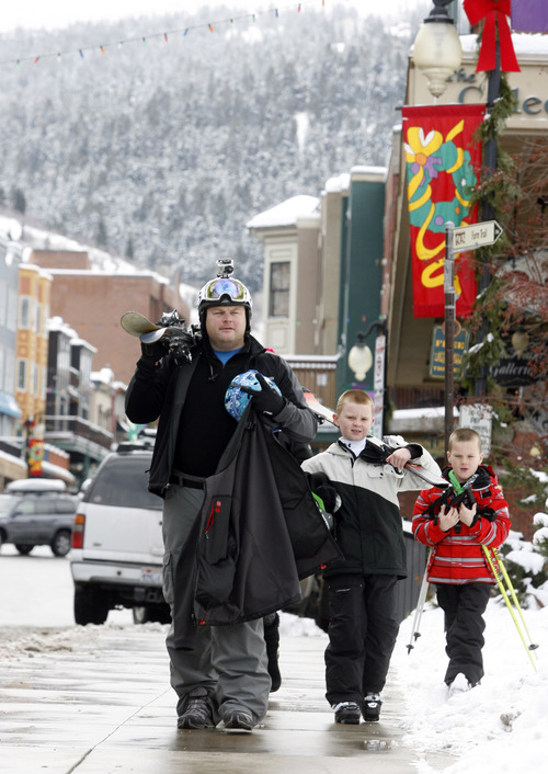 Rick Egan  | The Salt Lake Tribune 

Jason Couch, Michigan, walks down Main Street in Park CIty, with his sons  J.B. 9, and Sam, 8, Friday, December 28, 2012.