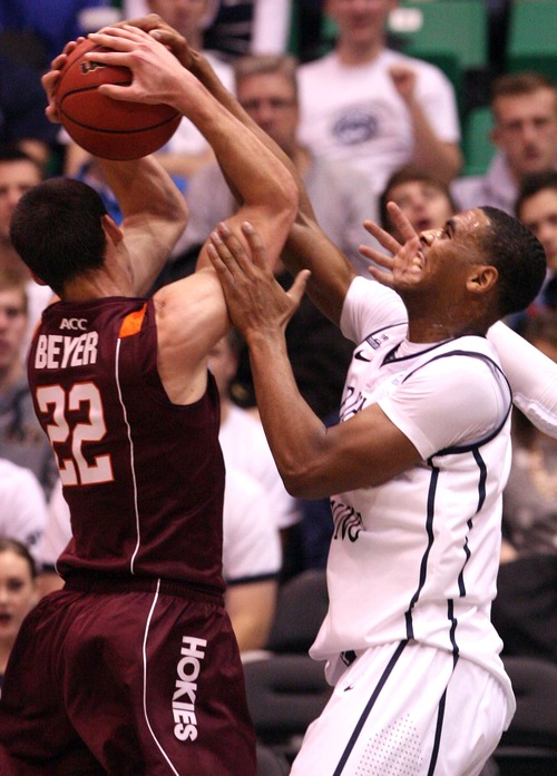 Leah Hogsten  |  The Salt Lake Tribune
Brigham Young Cougars forward Brandon Davies (0) fights Virginia Tech Hokies forward Christian Beyer (22) for the rebound. 
Brigham Young University defeated Virginia Tech 97-71, Saturday December 29, 2012 in Salt Lake City at Energy Solutions Arena.